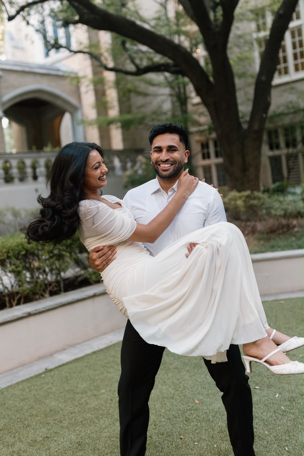 Ben holds Angela while they laugh together